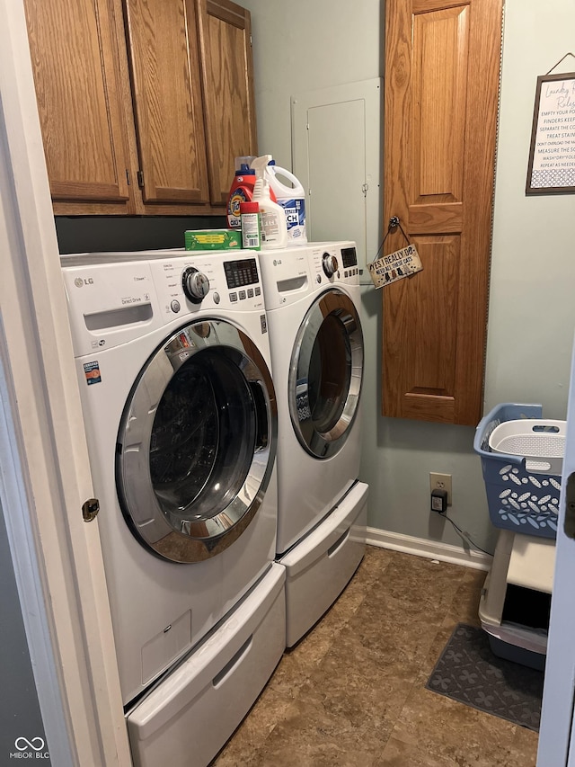 laundry area featuring cabinets and independent washer and dryer