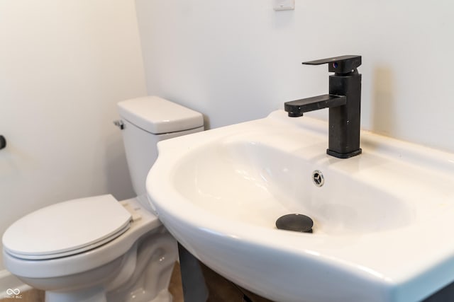 bathroom with sink and toilet