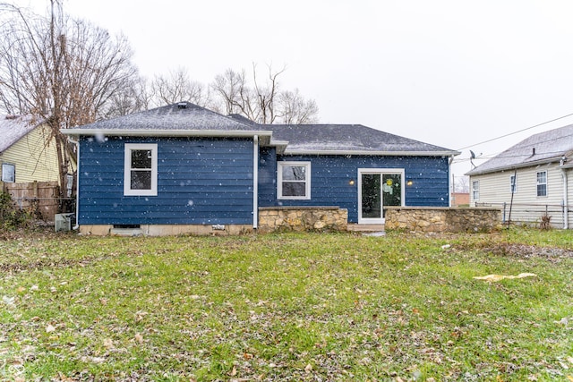 back of house with a yard