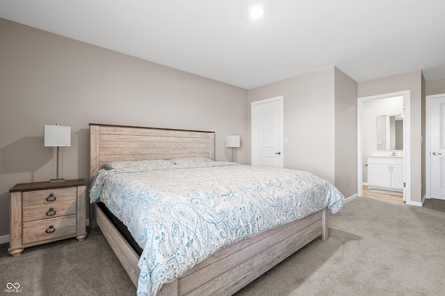 bedroom featuring carpet flooring and ensuite bath