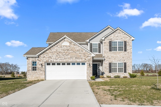 view of front of home with a garage and a front lawn