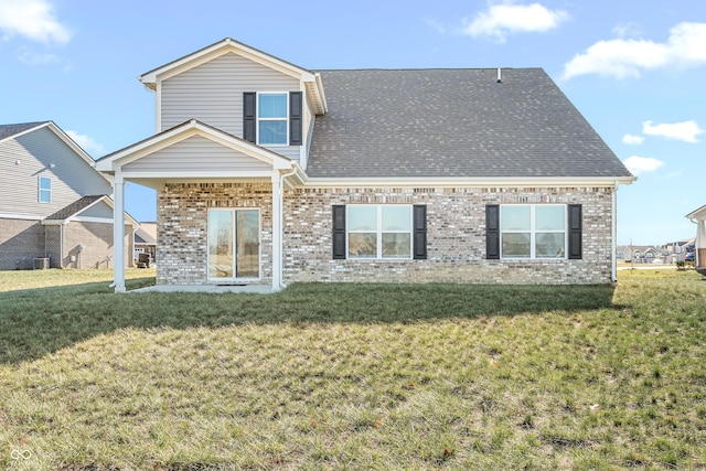 rear view of house with a lawn