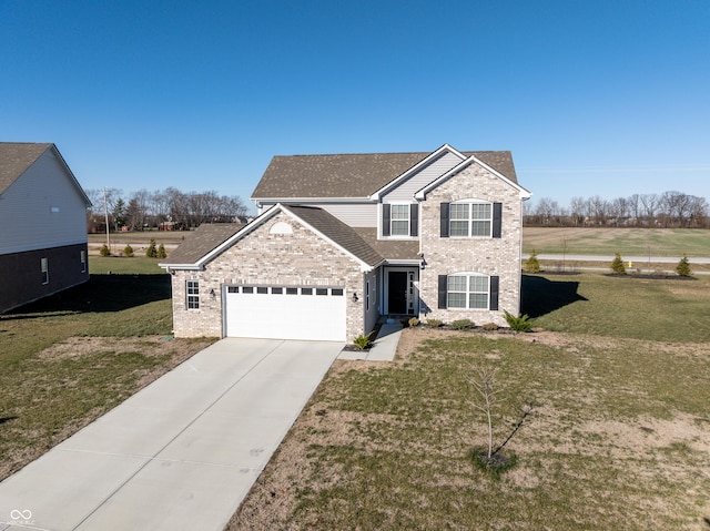 view of property featuring a front yard and a garage