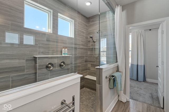 bathroom featuring tiled shower