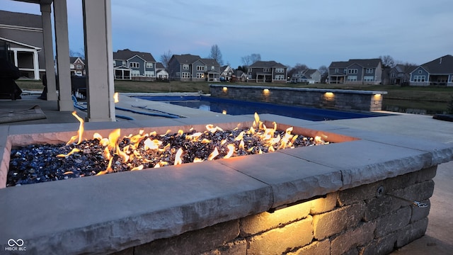 view of pool with a fire pit