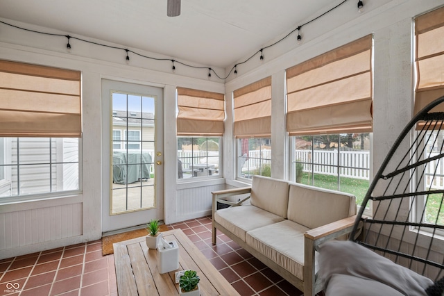 sunroom / solarium with ceiling fan