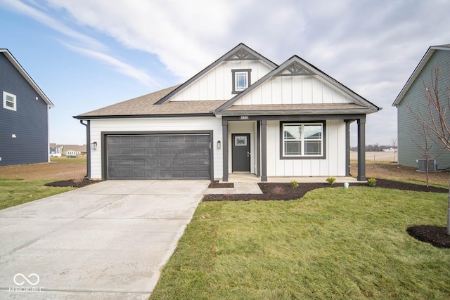 view of front of home with a front lawn and a garage