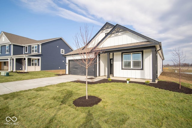 view of front facade with a front yard and a garage