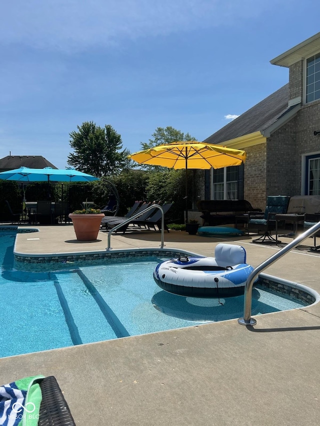 view of pool with a patio area