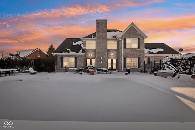 view of snow covered property