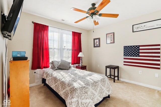 carpeted bedroom with ceiling fan