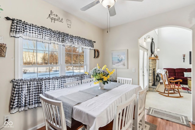 dining space featuring ceiling fan and wood-type flooring