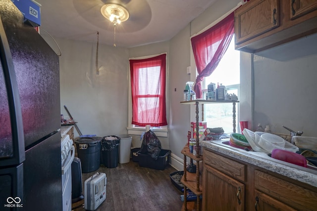 interior space with ceiling fan and dark wood-type flooring