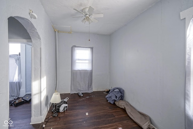 spare room with dark hardwood / wood-style floors and ceiling fan