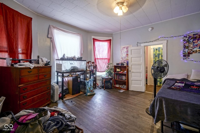 bedroom with hardwood / wood-style floors and ceiling fan