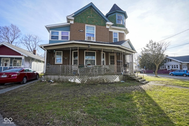 victorian-style house with covered porch and a front yard