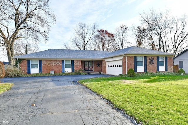 ranch-style house with a front lawn and a garage