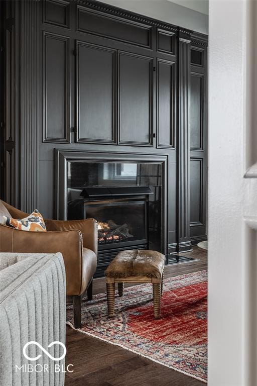 sitting room featuring dark hardwood / wood-style floors