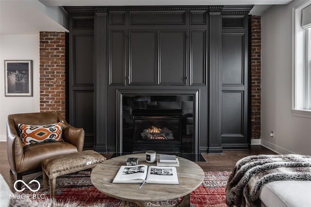 interior space with a fireplace and dark hardwood / wood-style floors