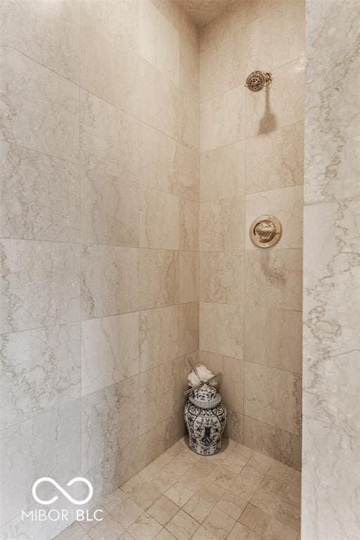 bathroom with a tile shower