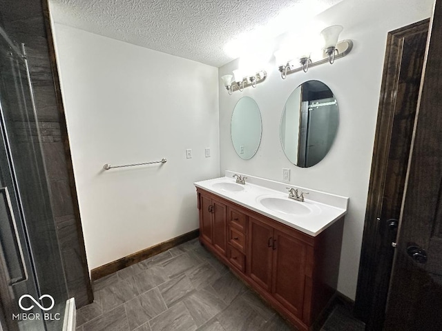 bathroom featuring vanity and a textured ceiling