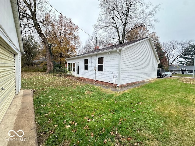 view of property exterior featuring a lawn