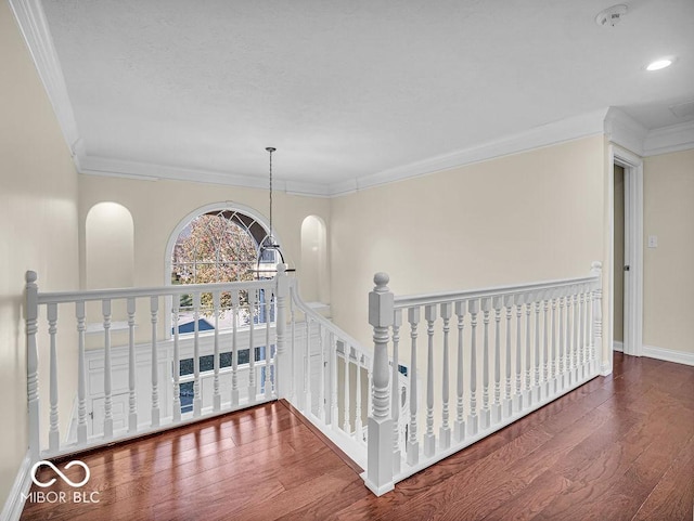 hallway featuring hardwood / wood-style flooring and crown molding