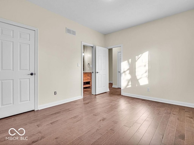 unfurnished bedroom featuring light wood-type flooring