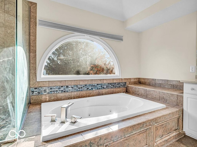 bathroom with tiled tub