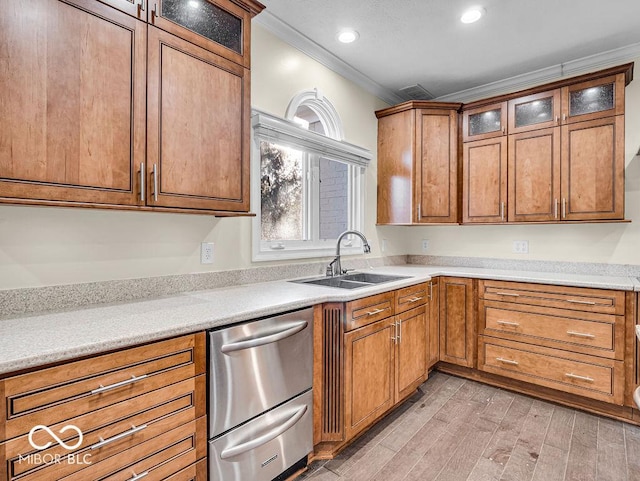 kitchen with dishwasher, light hardwood / wood-style floors, crown molding, and sink