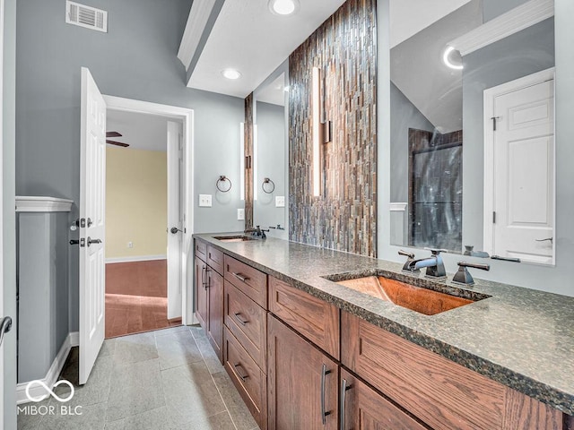 bathroom with vanity, a shower with door, ceiling fan, tile patterned flooring, and lofted ceiling