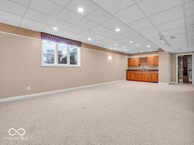 basement featuring light colored carpet