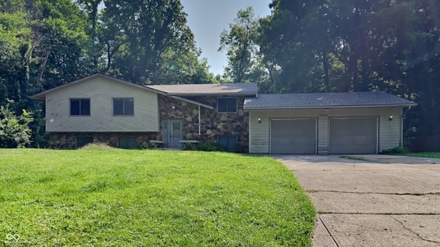 split level home with a garage and a front yard