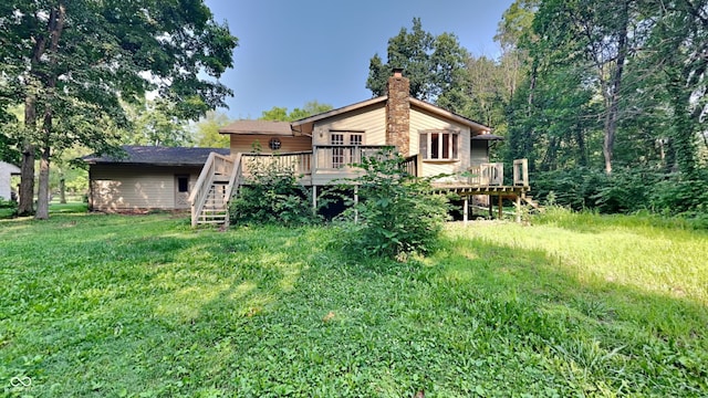 rear view of house with a wooden deck