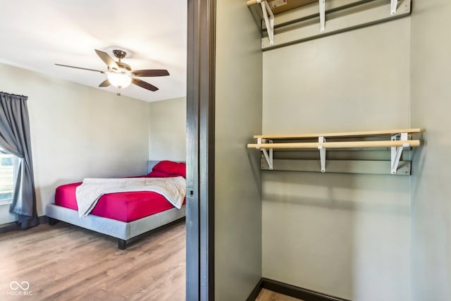 bedroom featuring ceiling fan and wood-type flooring