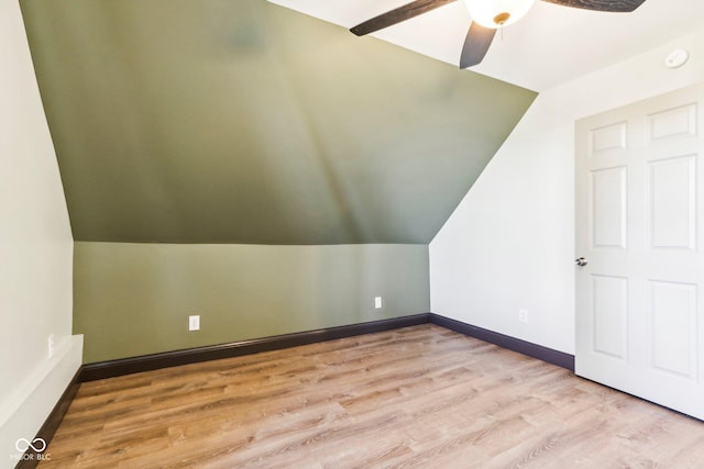 additional living space featuring ceiling fan, lofted ceiling, and light wood-type flooring