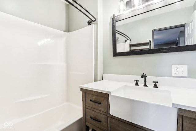 bathroom featuring vanity and shower / bath combination