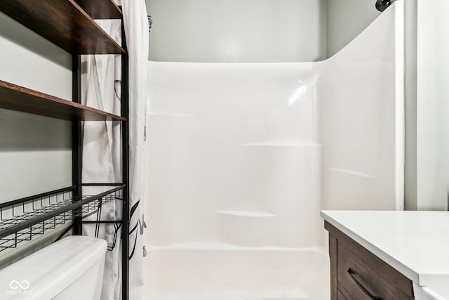 full bathroom featuring bathtub / shower combination, vanity, and toilet