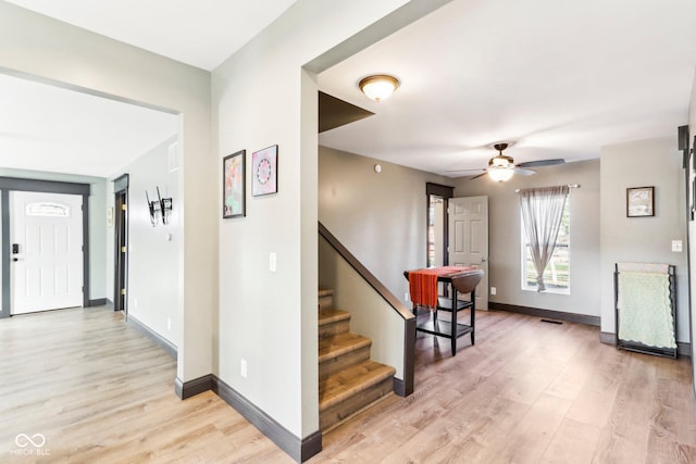 foyer featuring light hardwood / wood-style flooring and ceiling fan