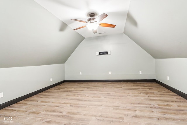 additional living space with light hardwood / wood-style floors, ceiling fan, and lofted ceiling