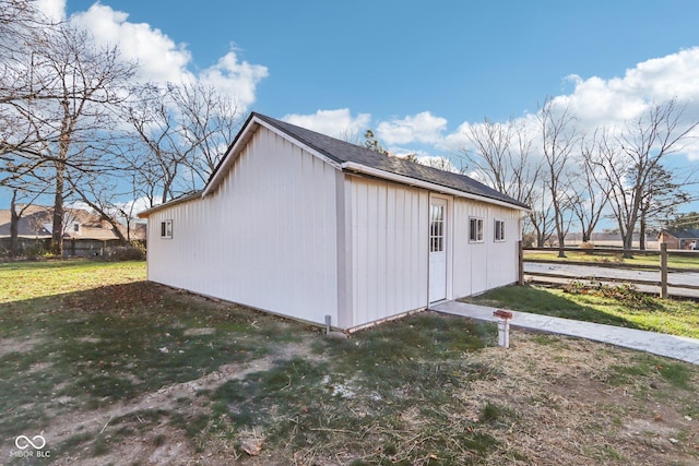 view of outbuilding with a lawn