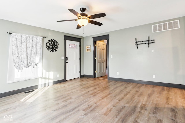 entryway with ceiling fan and light wood-type flooring