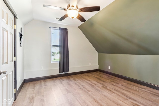 bonus room with light wood-type flooring, ceiling fan, and lofted ceiling