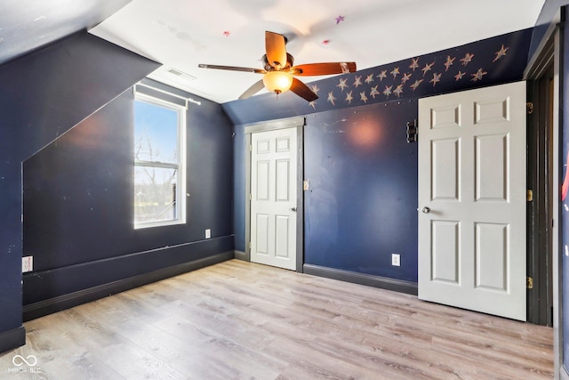 bonus room with ceiling fan, light hardwood / wood-style floors, and vaulted ceiling