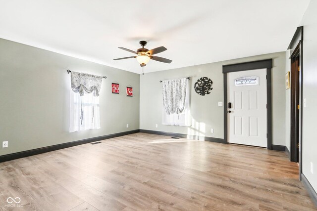 entryway with light hardwood / wood-style flooring and ceiling fan