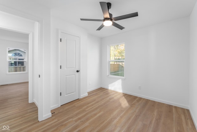 unfurnished bedroom featuring ceiling fan and light hardwood / wood-style flooring