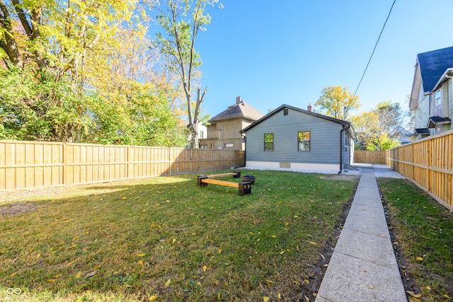 back of house with a lawn