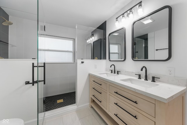 bathroom with vanity, tile patterned floors, and a shower with shower door