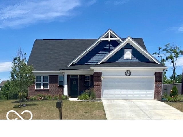 view of front of house featuring a garage and a front yard