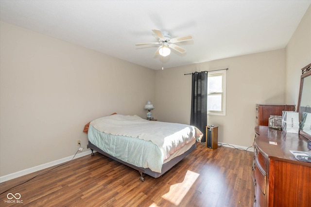 bedroom featuring ceiling fan and dark hardwood / wood-style flooring